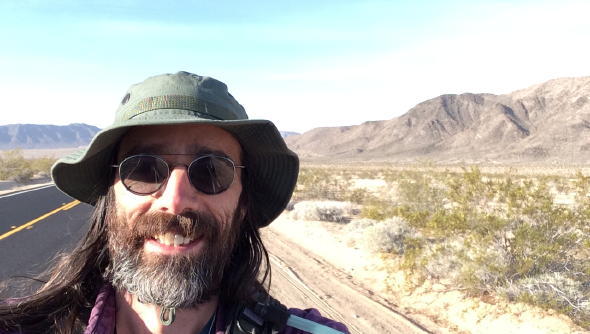 me in sunglasses and hat, in the southwestern U.S., on the 2014 Great March for Climate Action